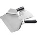 a metal shovel with black handles