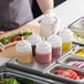 a tray of food with condiments on it