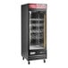 An Avantco black single door wine merchandiser with glass shelves.