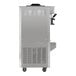 A commercial floor model soft serve ice cream machine with a stainless steel exterior, wheels, and side ventilation panels.