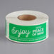 A roll of green and white TamperSafe paper labels with white text reading "Enjoy With Peace Of Mind"