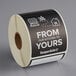 A roll of black paper TamperSafe labels with white text reading "From Our Kitchen To Yours"