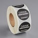 A roll of TamperSafe drink responsibly labels with black and white text.