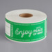 A roll of white paper with green TamperSafe labels that say "Enjoy with Peace of Mind"