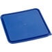 A white square plastic food storage container with a blue lid.