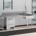 A Regency stainless steel dishtable with a left drainboard, a large sink, and a dishwasher.