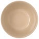 A close up of a tan Carlisle melamine bouillon cup.