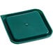 A white square polypropylene food storage container with a green square lid.