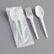 A white EcoChoice CPLA spoon and fork in plastic packaging.