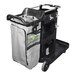 A black and silver Unger RestroomRx janitor cart with a grey bag and black handles.