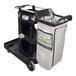 A black and grey Unger RestroomRx janitor cart with a bag.
