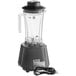 An AvaMix commercial blender with a cord attached.
