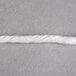 A close-up of white Choice Butcher Sausage Twine.