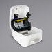 A white San Jamar hands free roll towel dispenser with a clear glass screen.