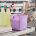 A purple Noble King-Pail 3 quart allergen-free sanitizing pail on a metal cart next to cleaning supplies.