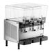 A Vollrath refrigerated beverage dispenser with three clear containers on top.