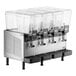 A Vollrath refrigerated beverage dispenser with four clear containers.