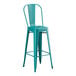 A teal metal bar stool.