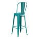 A teal metal outdoor cafe barstool with a backrest.