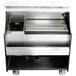 A silver Perlick mobile bar with a stainless steel counter and sink.