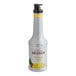 A white Monin bottle of pineapple fruit puree.