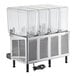 A Vollrath refrigerated beverage dispenser with four clear containers.