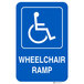 A blue Lavex aluminum sign with a white wheelchair symbol and white letters reading "Handicapped Parking / Wheelchair Ramp"