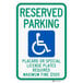 A green sign with white lettering reading "Handicapped Reserved Parking" and a white wheelchair symbol.