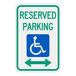 A green and white aluminum sign with a wheelchair symbol and an arrow pointing right.