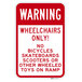 A red and white rectangular sign that says "Warning / Wheelchairs Only!" in white letters.