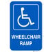 A blue Lavex aluminum sign with a white wheelchair symbol and white letters reading "Handicapped Parking / Wheelchair Ramp"