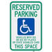 A green and blue aluminum parking lot sign that says "Handicapped Reserved Parking / Vehicles With Dis Or Dis Vet Plates" with a wheelchair symbol.