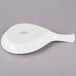 A Tuxton white china fry pan server with a handle.