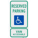 A green and blue aluminum sign with white text reading "Handicapped Reserved Parking / Van Accessible" and a white wheelchair symbol.