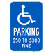 A blue and white parking sign with the words "Handicapped Parking / $50 to $300 Fine" and a wheelchair symbol.