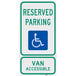 A green and blue aluminum parking lot sign that reads "Handicapped Reserved Parking / Van Accessible" with a white wheelchair symbol.