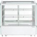 An Avantco white refrigerated countertop display case with glass doors and shelves.