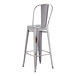 A Lancaster Table & Seating gray metal outdoor cafe barstool with a backrest.