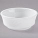 A Tuxton bright white china bowl with an embossed rim.