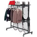 A Correll hanging chair and coat rack with a chair and clothes on it.