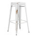 A white metal Lancaster Table & Seating outdoor barstool with a distressed finish.