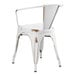 A white metal outdoor arm chair.