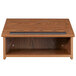 A medium oak wooden tabletop lectern with a black top shelf.