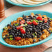 A plate of rice and Bella Vista black beans in brine.