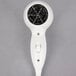 A white Conair wall mount hair dryer with a black circle on top.