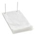 A stack of clear plastic gusseted bread bags on wicket dispenser.