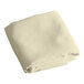 A folded ivory rectangular table cover on a white background.