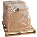 A pallet with boxes wrapped in clear plastic using a Lavex pallet cover.