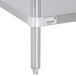 A wood work table with a stainless steel undershelf.