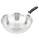 A Vollrath stainless steel saucier pan with a black handle.